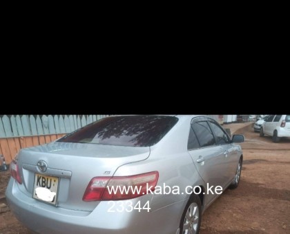Buy and drive Toyota Camry.